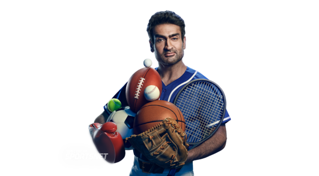 Man holding multiple sports balls surrounded by logos including NBC Sports, YES Network, FanDuel Sports Network, and Spectrum SportsNet.
